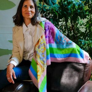 woman wearing French Roses Cotton and Silk Oversized Square Shawl, seated