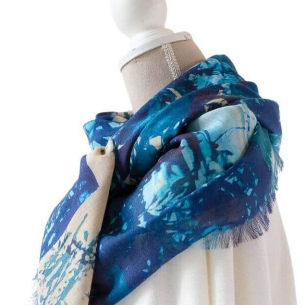 side view of Treescape cashmere and silk oversized square shawl blue green stone beige colour