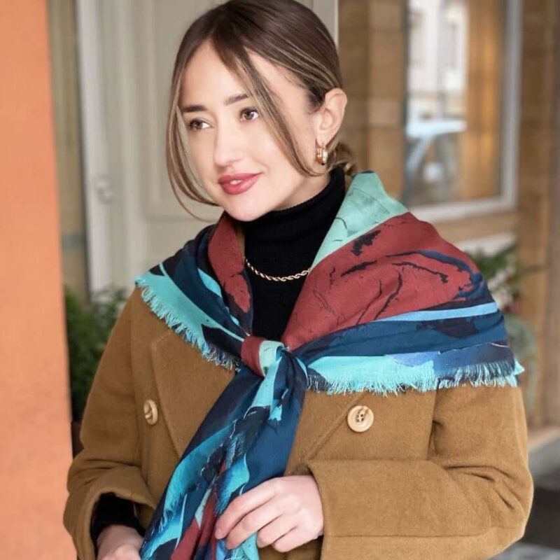woman wearing camelia winter rose cashmere and silk oversized square scarf