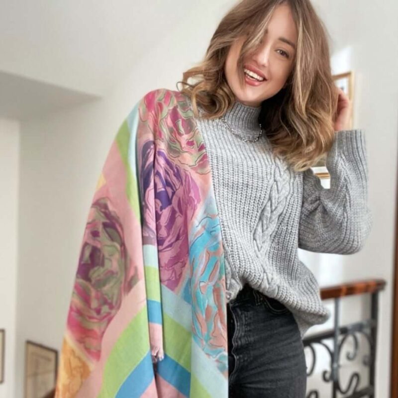 woman wearing Louis Jane French Roses oversized shawl cashmere and silk in pink, green and blue colours