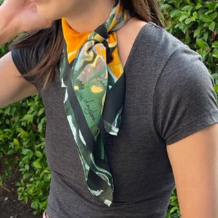 woman wearing poppies small square silk scarf, tied